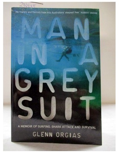 Man in a Grey Suit. Glenn Orgias....